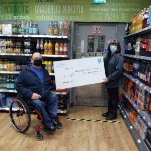 Dreghorn cooperative presented cheque to treasurer Gordon Rainey for £200 from their welfare fund. Dreghorn Cooperative Cheque Presentation
