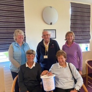 Mary Senior and ladies from Troon Welbeck Ladies Golf Club presenting chairman Dick McLachlan with £518.87 raised at their recent captain's charity day. Troon Welbeck Ladies Golf Club