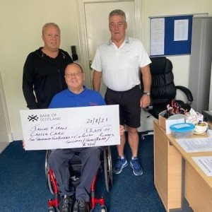 Photo of John Lapping and James Keen presenting Gordon with a cheque for £2,405.00 raised by John Lapping and Richard Baird cycling from Lands End to Irvine with James Keen as their support driver John Lapping & James Keen